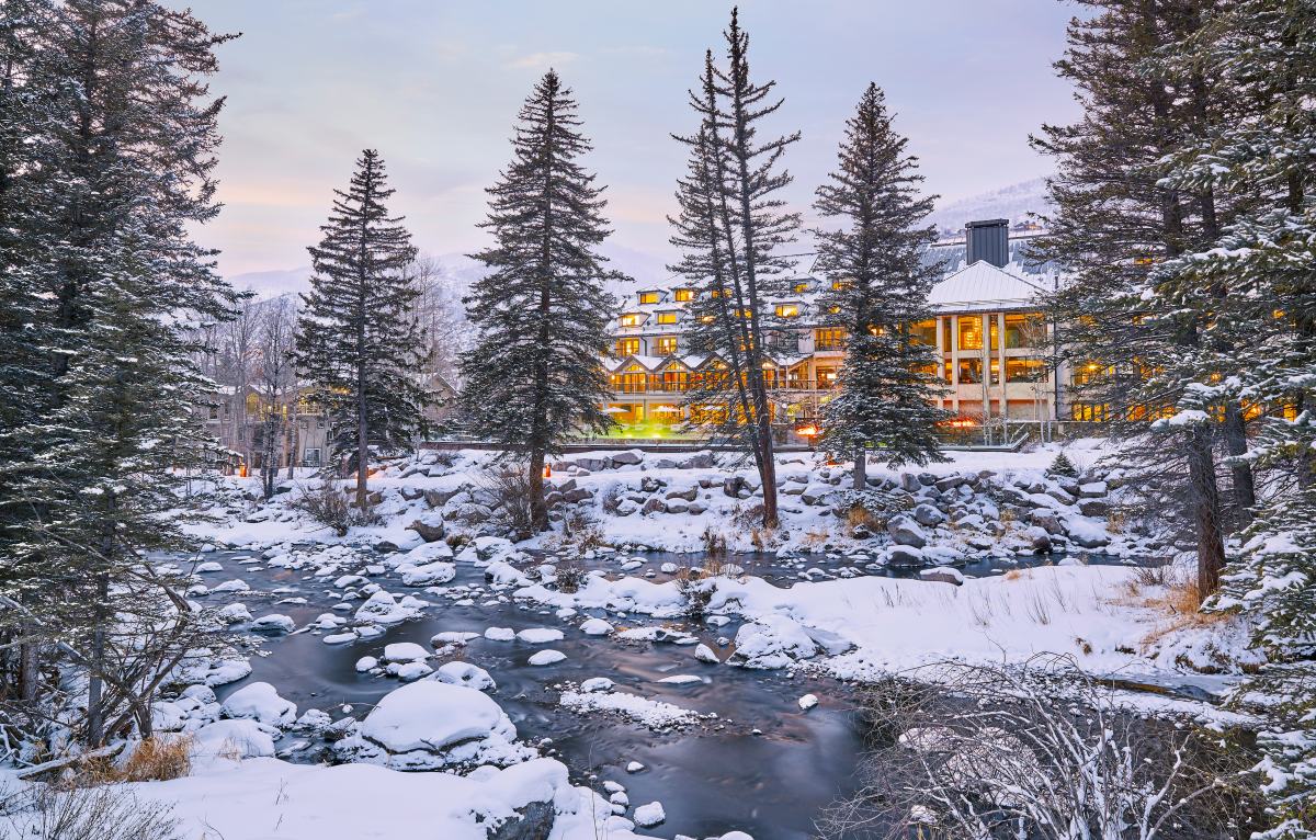 Grand Hyatt Vail, Gore Creek, exterior view across the river snow covered